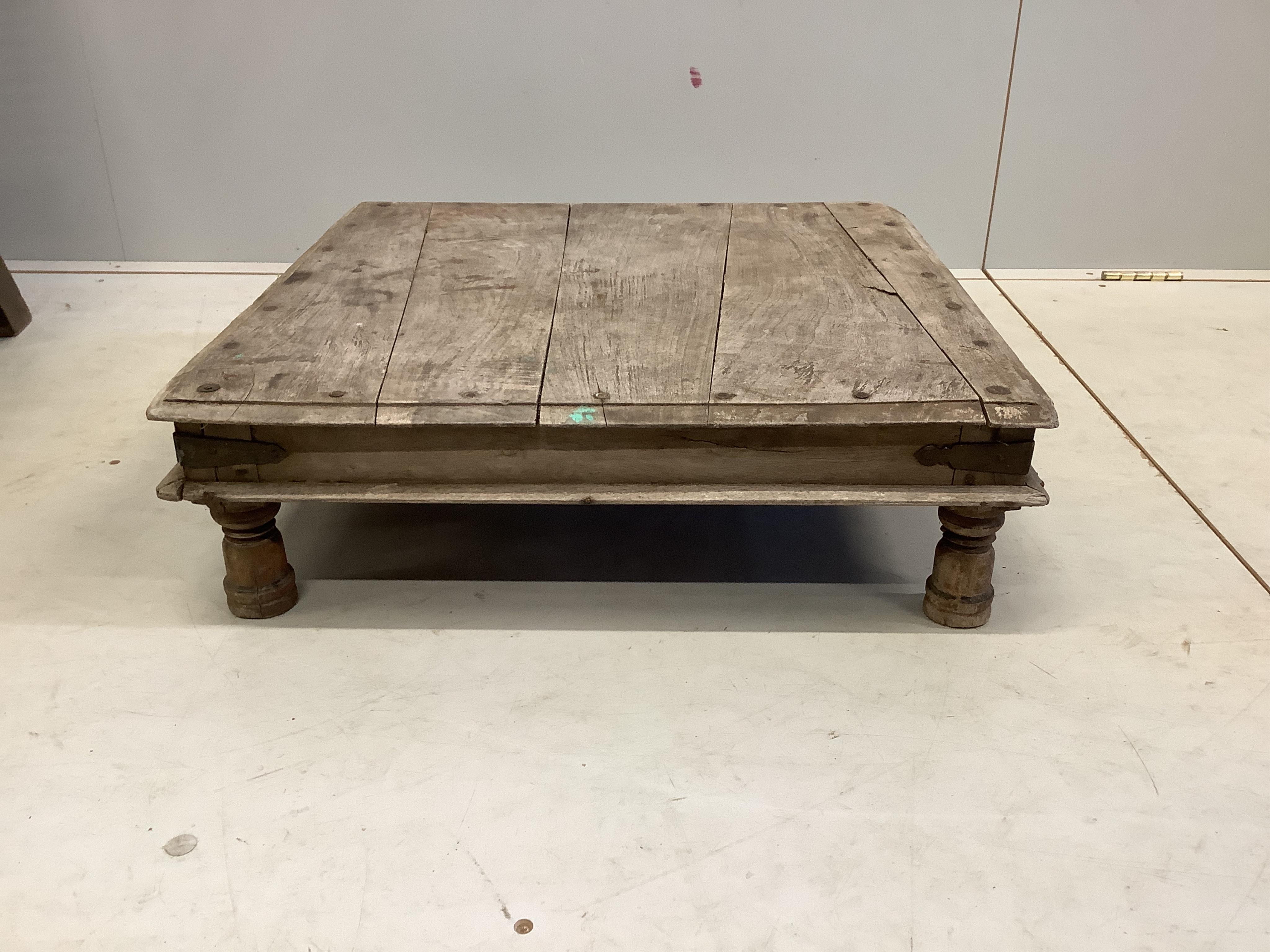 A South East Asian caned hardwood armchair, width 55cm, depth 80cm, height 98cm together with a square low table